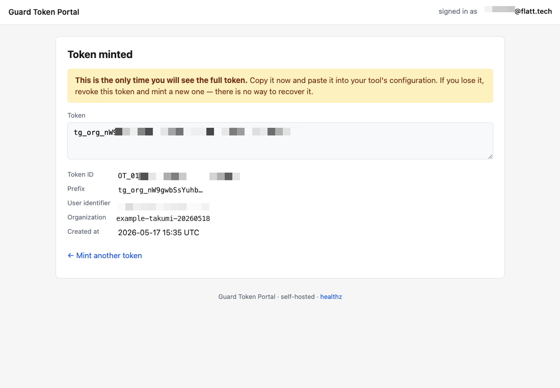 After minting — the plaintext token shown once, plus token id, prefix, user identifier, and creation metadata